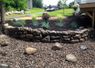 Retaining walls can come in more natural forms such as this field stone wall