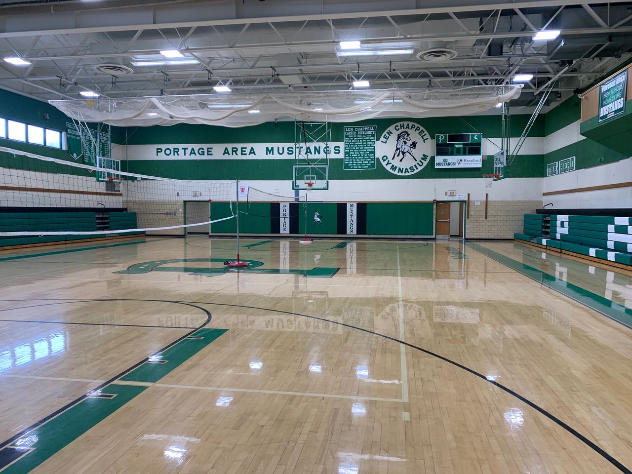 Len Chappell Gymnasium, with the circular sign with Len's name on the back wall. Len Chappell Gymnasium, with the circular sign with Len's name on the back wall.