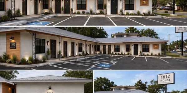 Exterior views of 1812 House motel with parking spaces and signage.