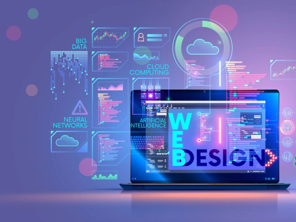 Laptop displaying web design and related tech terms graphics.