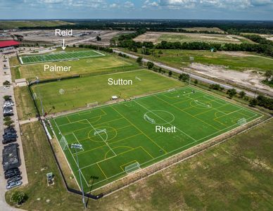 Aerial view of multiple labeled soccer fields named Reid, Palmer, Sutton, and Rhett.