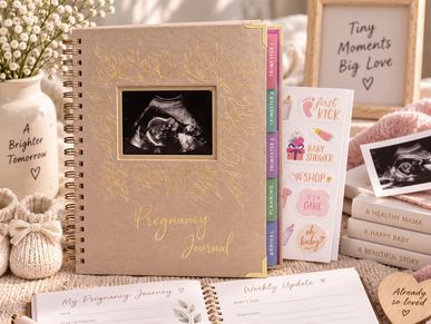 Pregnancy journal and ultrasound photo setup.
