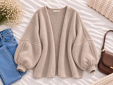 Cozy beige knitted cardigan with balloon sleeves.