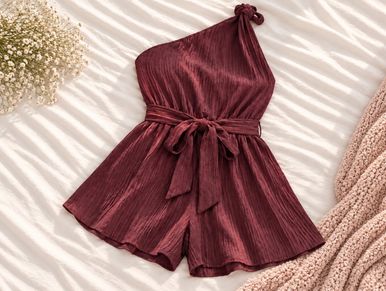 A stylish burgundy one-shoulder romper with a waist tie.