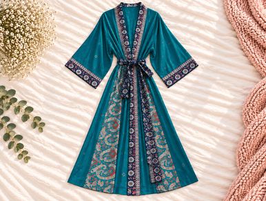 Teal floral patterned women's robe with belt.