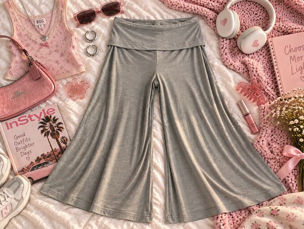 Gray wide-leg pants surrounded by pink accessories.