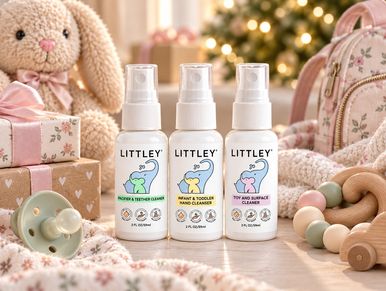 Three Littley baby cleansers with toys and gifts.