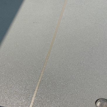 Expansion joint was ripped out, then filled with sika caulking. 