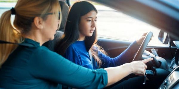 Teenager and instructor during driving lesson