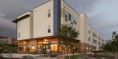 An exterior image of PATH, an apartment complex with white siding. 