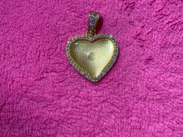 Gold heart necklace .
