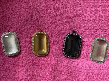 Silver, gold, black & rose gold rectangular necklaces.