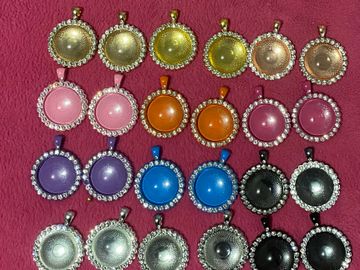 Rhinestoned circular necklaces in various colors.