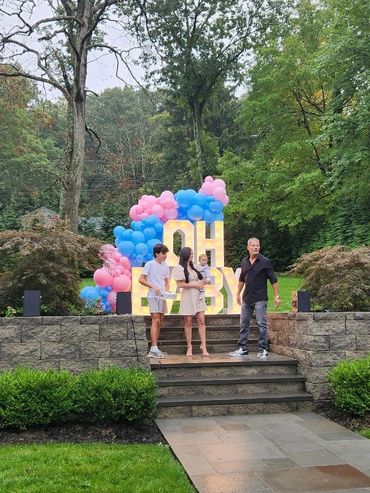Pink and blue gender reveal balloons