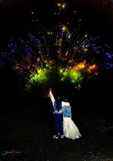 Multicolor fan firework with bride and groom