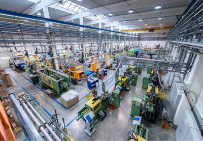 Large industrial factory floor with machinery and equipment.