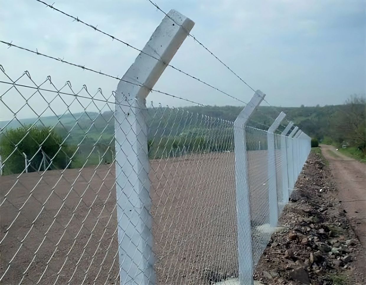 Fencing installation using GI chainlink mesh and barbed wire