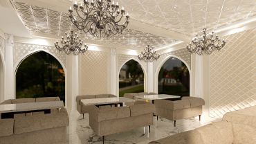 Luxurious lounge with chandeliers and patterned walls.