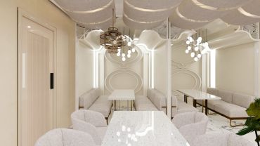 Modern dining area with beige seating and elegant chandeliers.