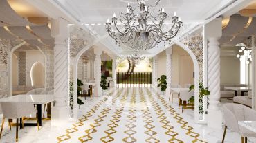 Luxurious corridor with chandeliers and ornate design.