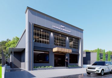 Modern brewery building with parked white cars.