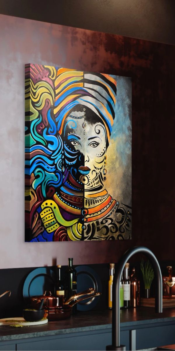 Colorful abstract portrait painting on a kitchen wall above the counter.