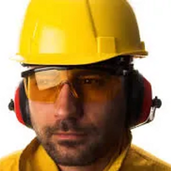 Industrial Worker with Protective  Earmuffs, amber safety glasses and wearing a yellow hard hat