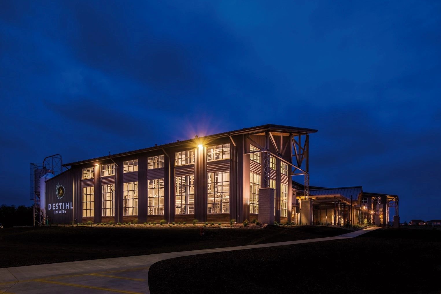 An exterior image of DESTIHL Brewery and Beer Hall at dusk.