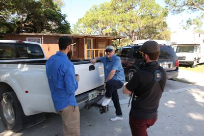 The director Mark Solley talks to the crew on location.