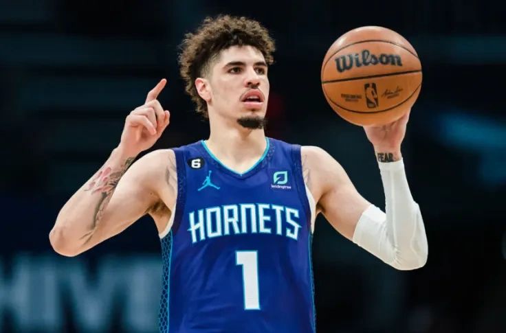 LaMelo Ball, a talented young point guard for the Charlotte Hornets, showcasing his skills on the court while holding a basketball.