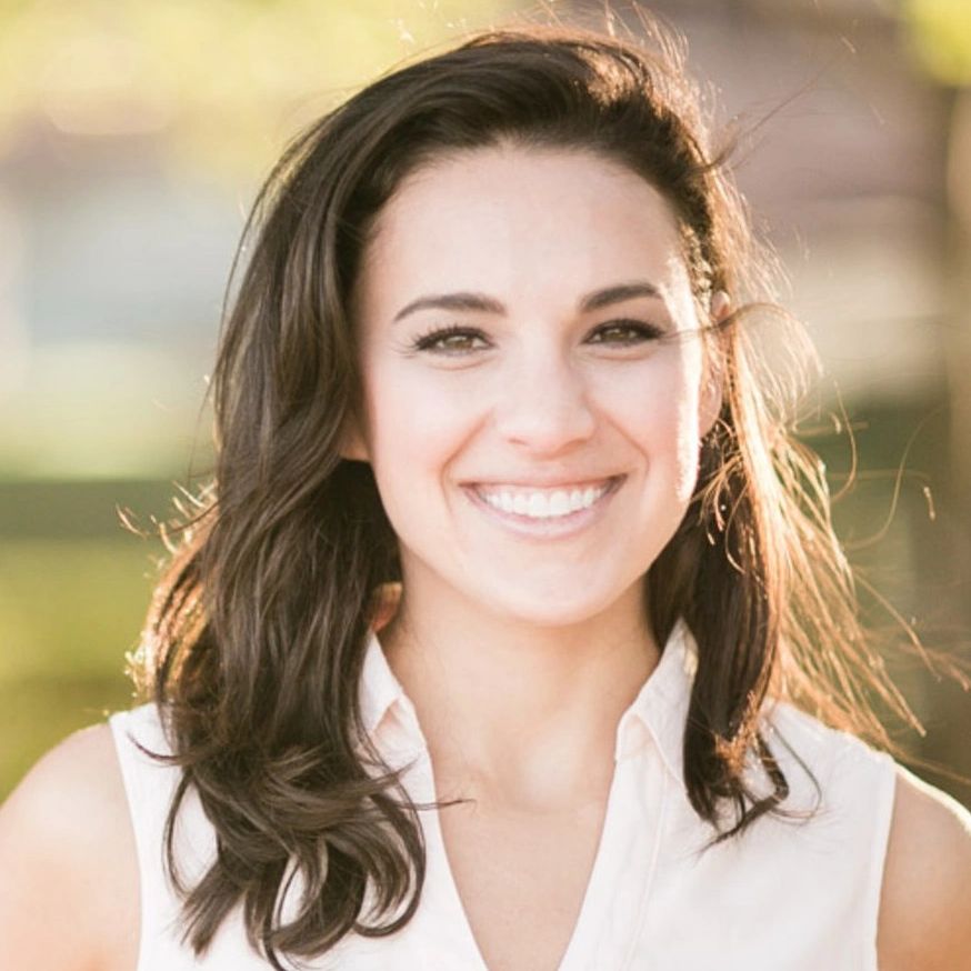 A young woman smiling at the camera