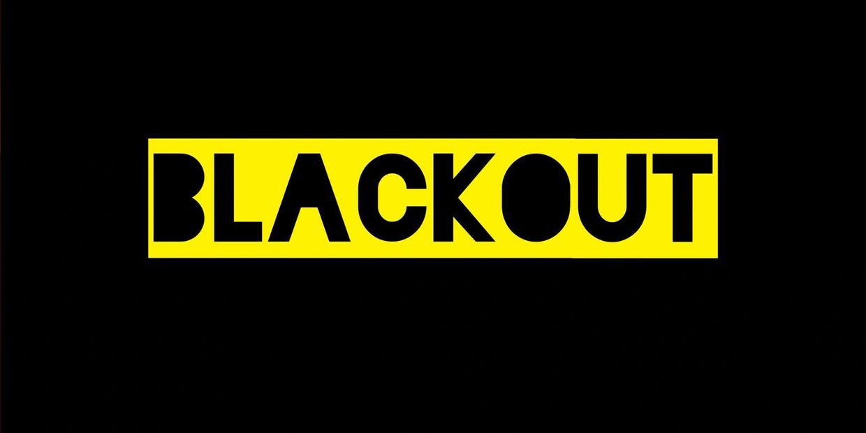 An image of the official yellow and black BLACKOUT improv group logo. 