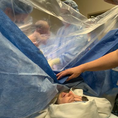 mother can see her baby through a clear sheet during a C-section