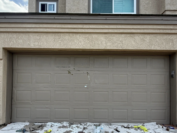 A garage door with severe fading, peeling paint, and years of sun exposure brought back to life through proper preparation, quality materials, and attention to detail.

Sometimes a fresh finish can completely transform a home's curb appeal without the cost of replacement.
