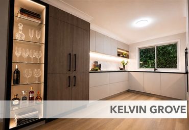 Modern kitchen with sleek cabinetry and built-in glass display in Kelvin Grove.