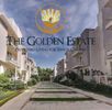 Entrance view of The Golden Estate, a senior living community with modern buildings and greenery.