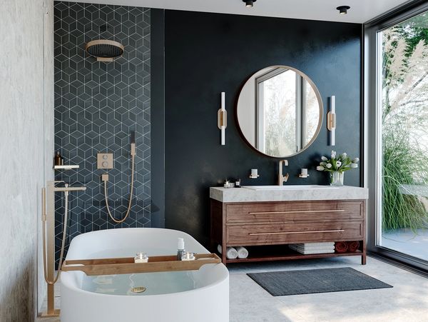 Modern bathroom with a bathtub and wooden vanity.
