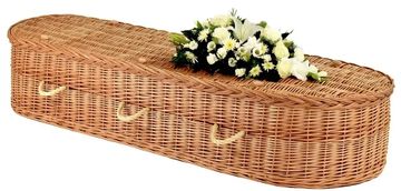 A buff or white coloured wicker coffin with rounded ends and coloured bow options