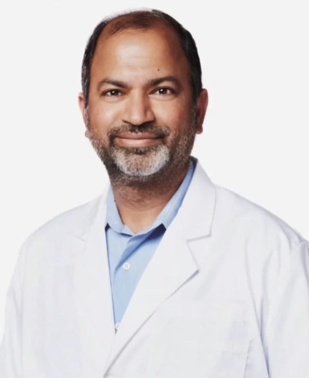 Dr. Muzakeer Shaik, geriatrician at Lone Star Medical Associates, wearing a white coat