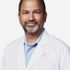 Dr. Muzakeer Shaik, geriatrician at Lone Star Medical Associates, wearing a white coat
