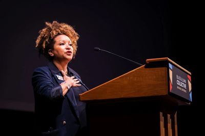 Woman speaking at a podium.
