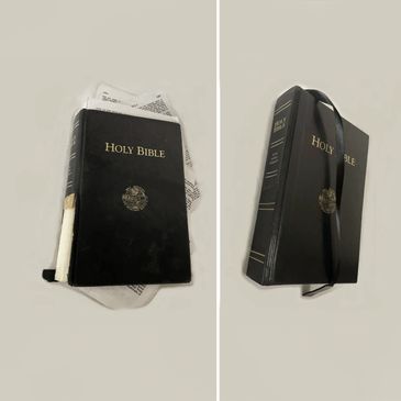 Black Holy Bible with a ribbon bookmark shown from two angles.
