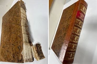 Antique book restoration with repaired spine and detailed leather rebinding.