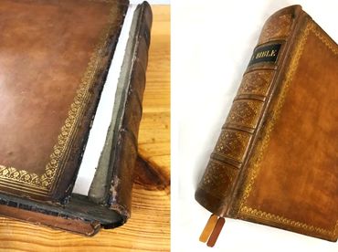 Bible restoration with repaired spine, leather cover, and gold detailing.