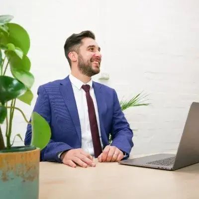 Tony Insurance sitting at a desk
