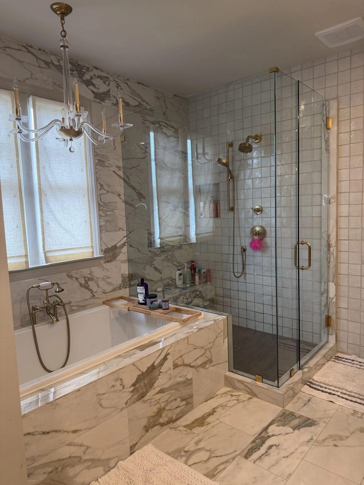 Marble bathroom with glass shower after a deep clean in Cumming, GA