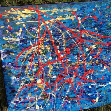 Abstract painting with vibrant blue and red splashes.