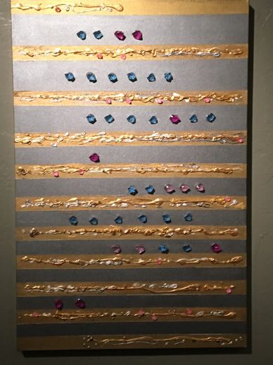 Abstract artwork with horizontal gold stripes and colored dots.