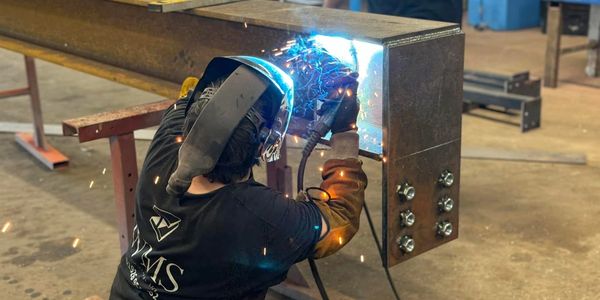 Worker welding a custom structural steel job