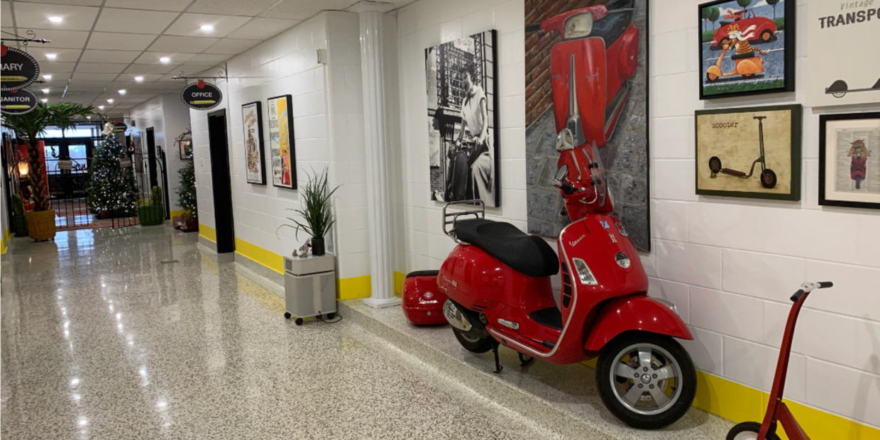 Vespa scooter in school hallway